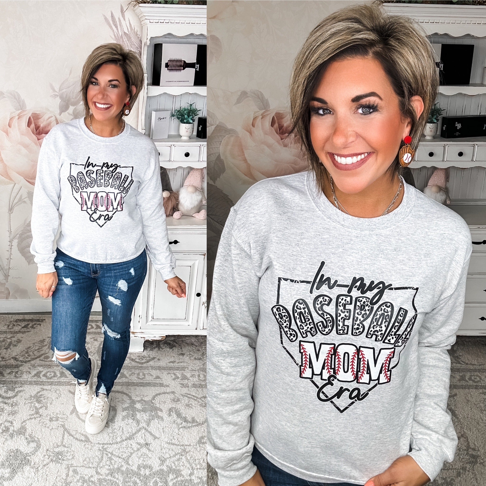 A woman wearing a gray pullover sweatshirt with the text 'In My Baseball Mom Era'