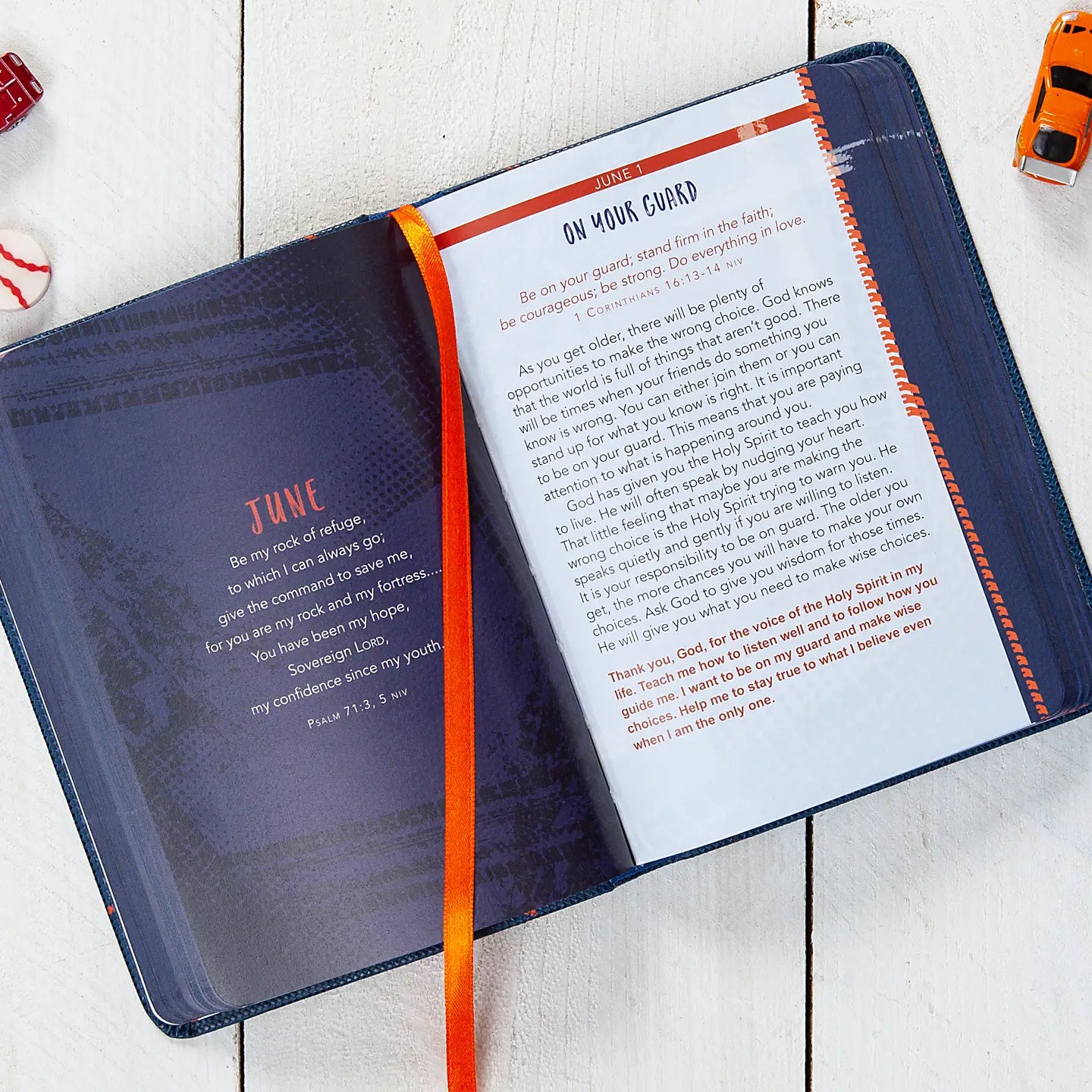 Devotional opened to a page titled "On Your Guard" laying on a white wooden surface.