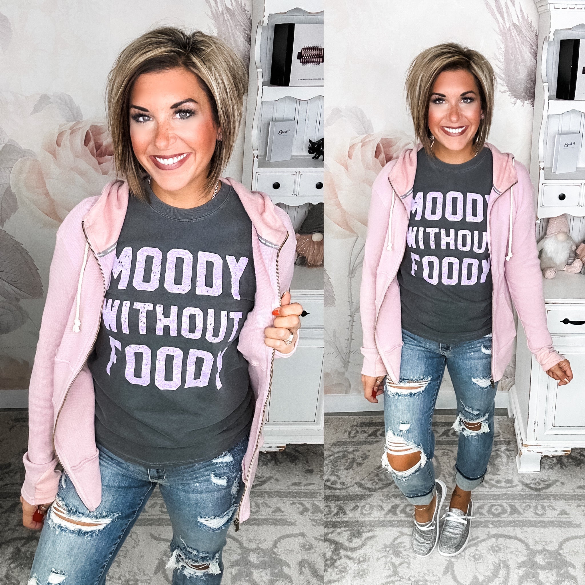 A woman wearing a gray graphic tee that says 'MOODY WITHOUT FOODY' paired with ripped jeans and gray sneakers.