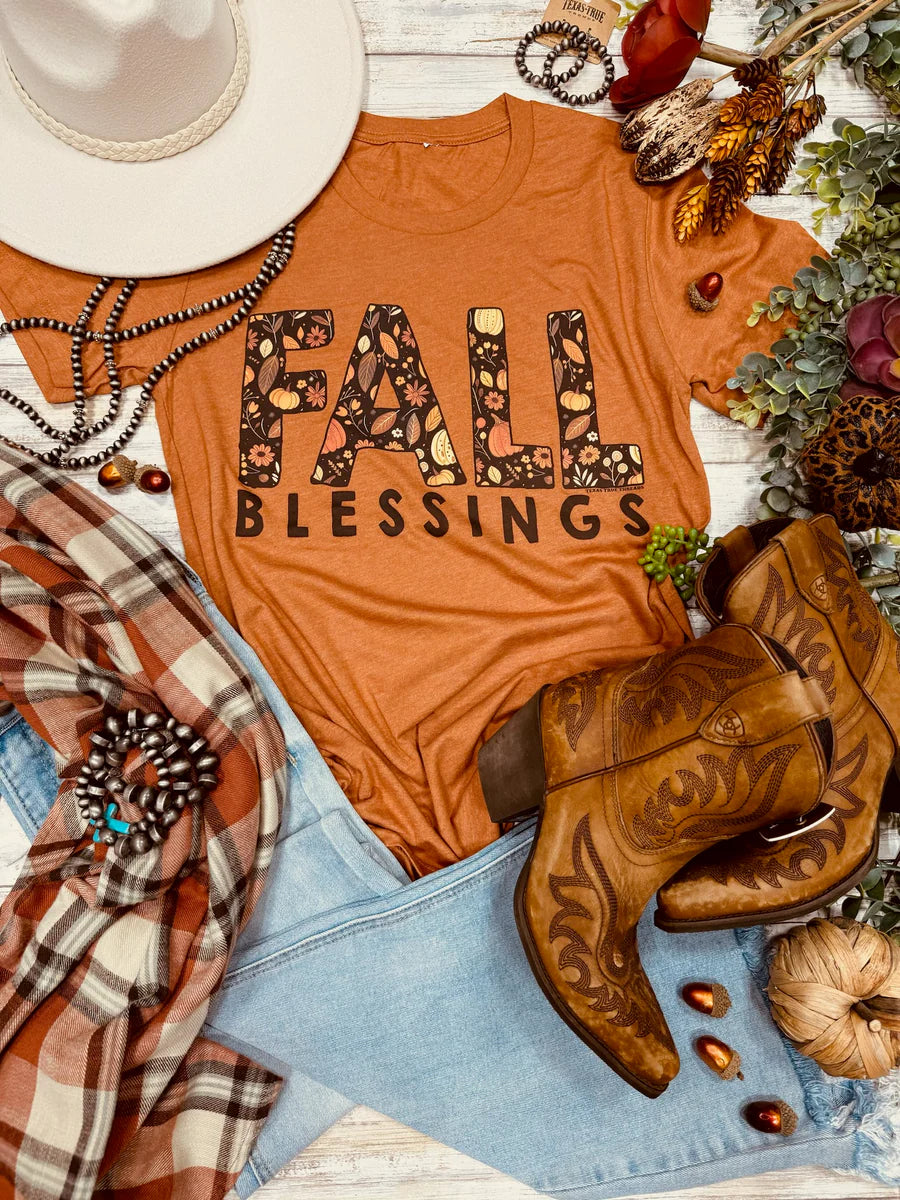 An orange t-shirt with the words 'Fall Blessings' in a leaf design