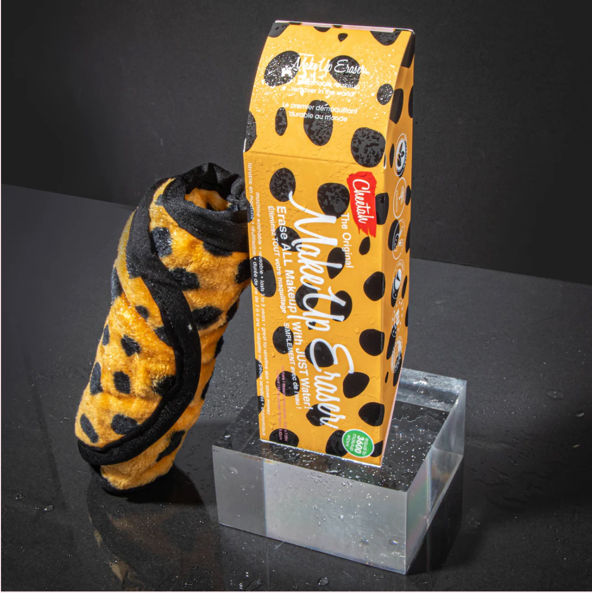A cheetah-patterned MakeUp Eraser product packaging with the eraser visible inside.