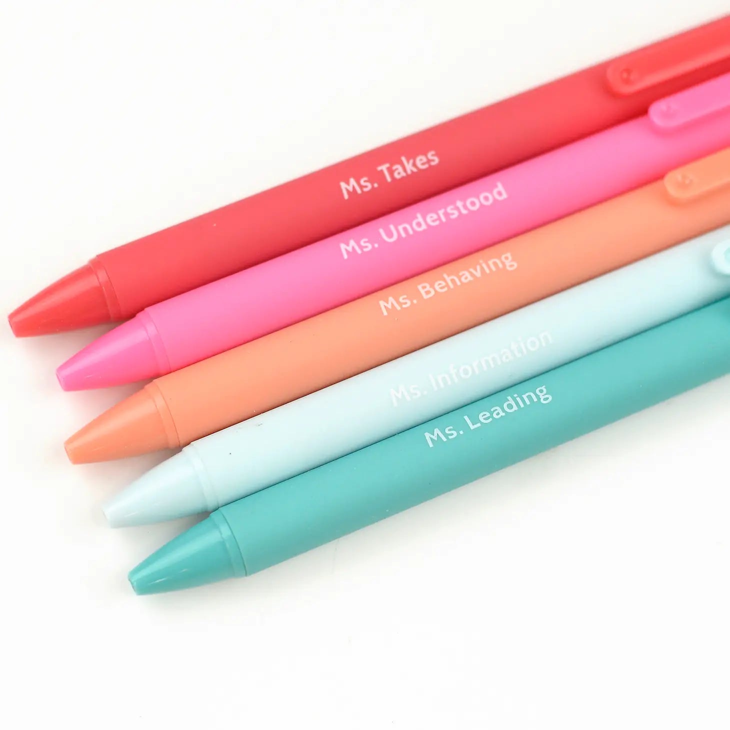 A set of five colorful pens with unique inscriptions on each, presented on a white background.
Ms. Takes
Ms. Understood
Ms. Behaving
Ms. Information
Ms. Leading