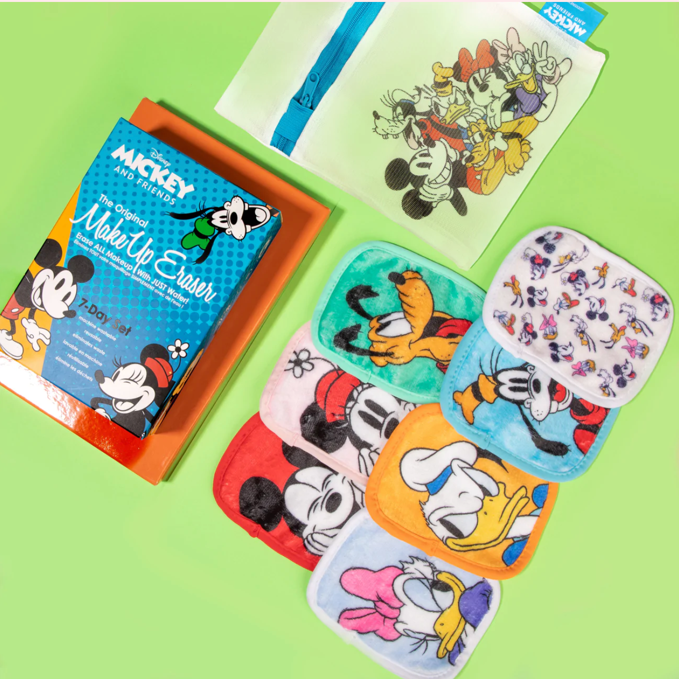 A set of seven Mickey and Friends makeup erasers displayed with a laundry bag and the product box.