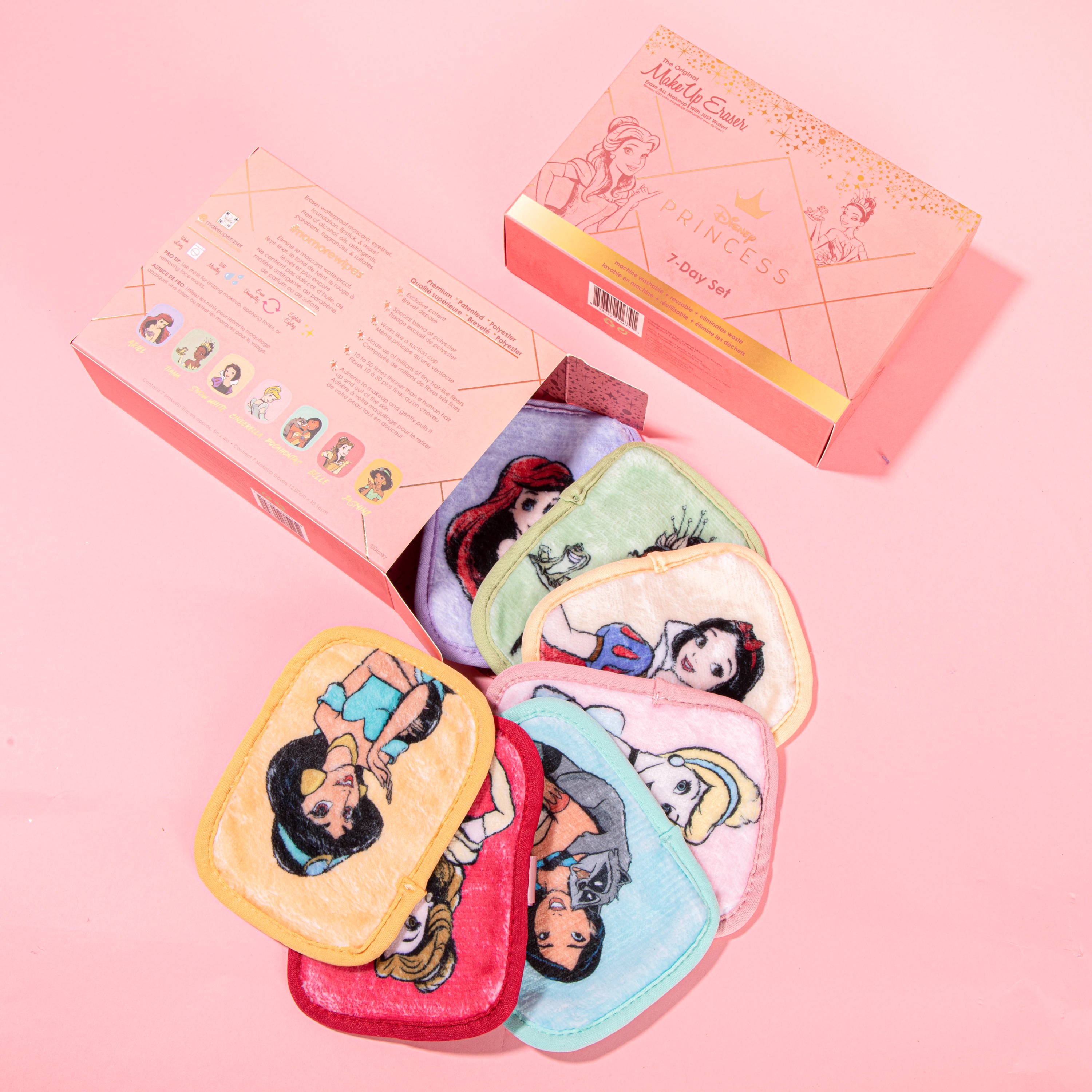 A collection of seven small rectangular makeup remover cloths with Disney Princess character illustrations on each. They are displayed with the Disney Princess 7 Day Set Makeup Eraser box.