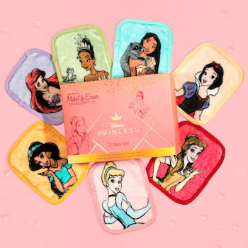 A collection of seven small rectangular makeup remover cloths with Disney Princess character illustrations on each. They are displayed with the Disney Princess 7 Day Set Makeup Eraser box.