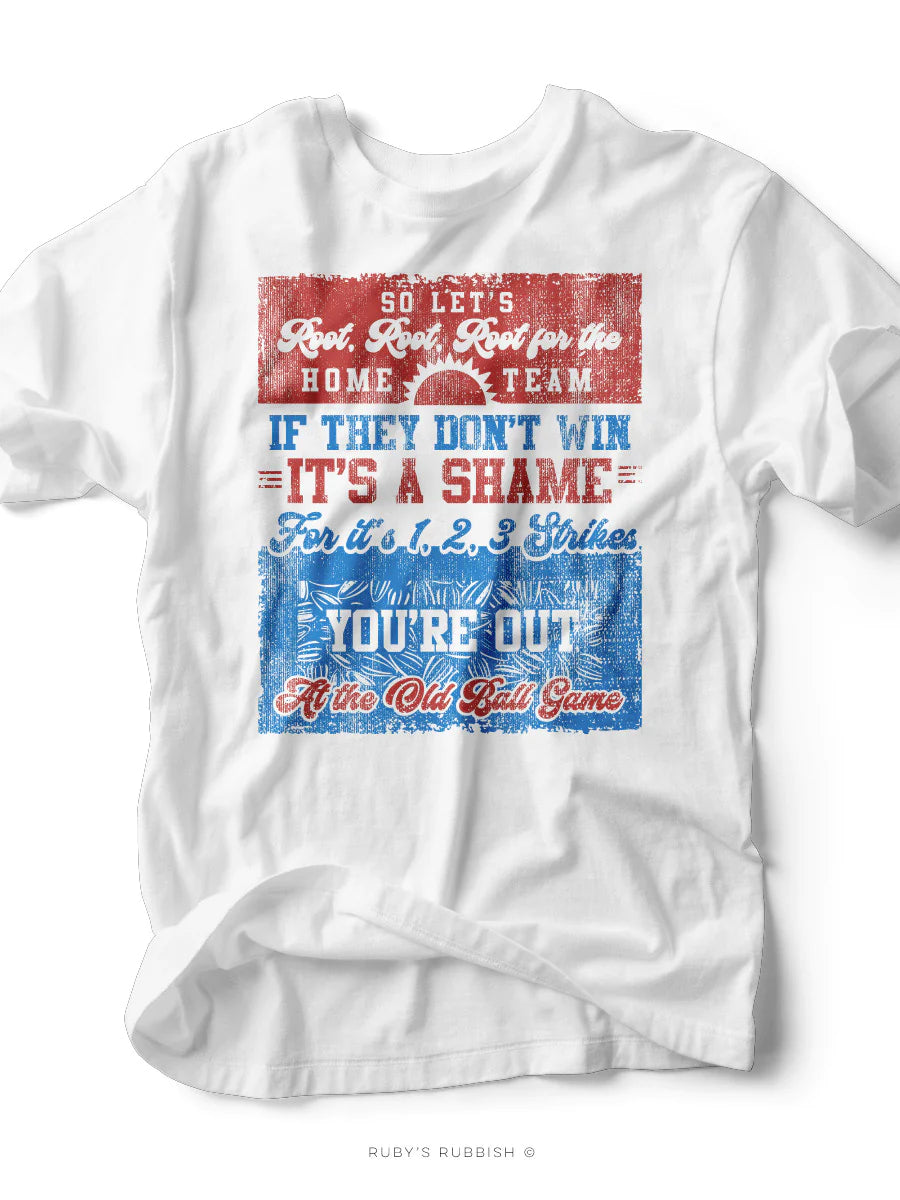 A white graphic tee with red and blue text and graphics, that says 'So let's root, root, root for the home team. If they don't win it's a shame. For it's 1,2,3 strikes you're out at the old ball game'
