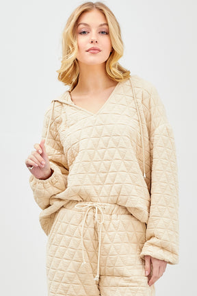A Point to This Quilted Pullover