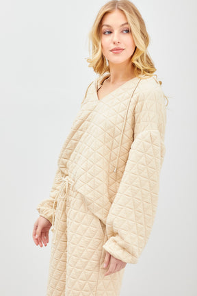 A Point to This Quilted Pullover
