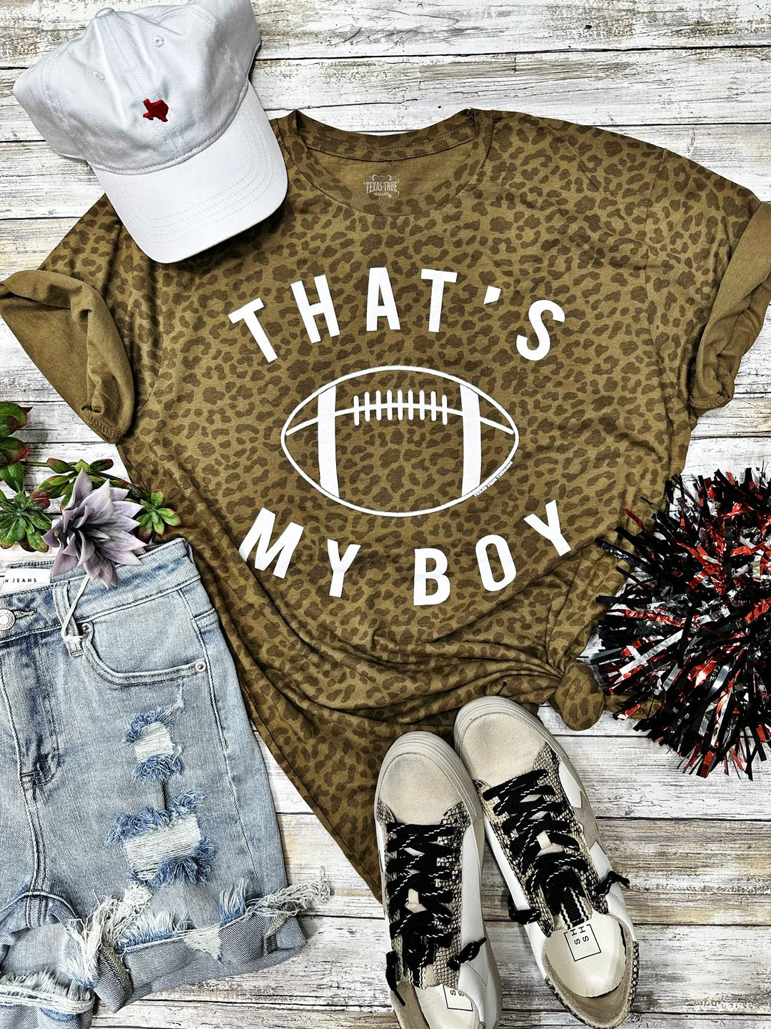 A leopard print t-shirt with 'That's My Boy' text and football graphic.
