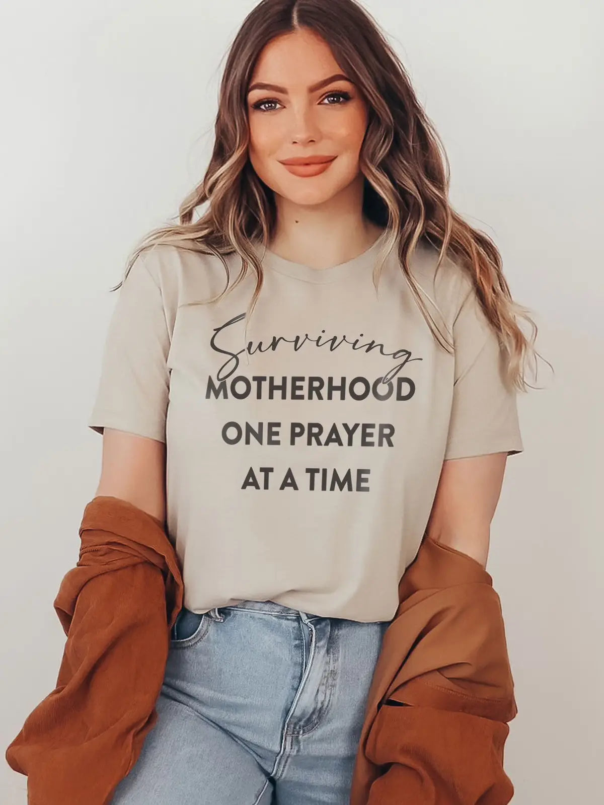 Surviving Motherhood Graphic Tee